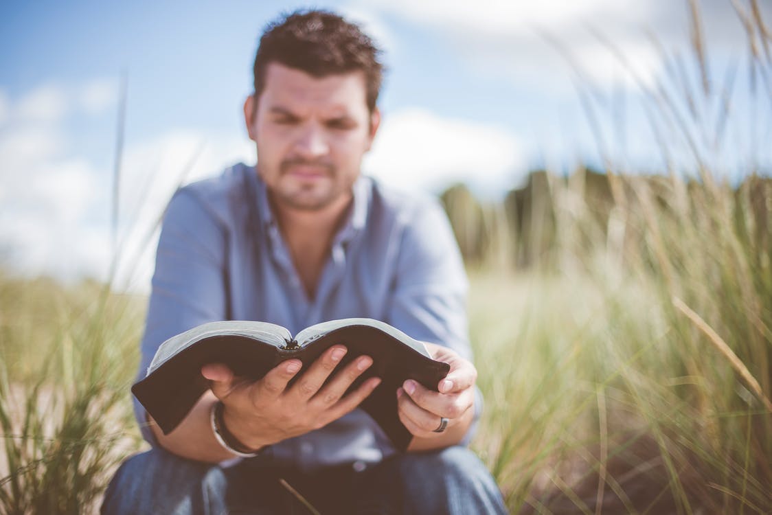 Man reading Bible Galatians